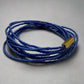 Blue beaded bracelet with a gold clasp on a gray background
