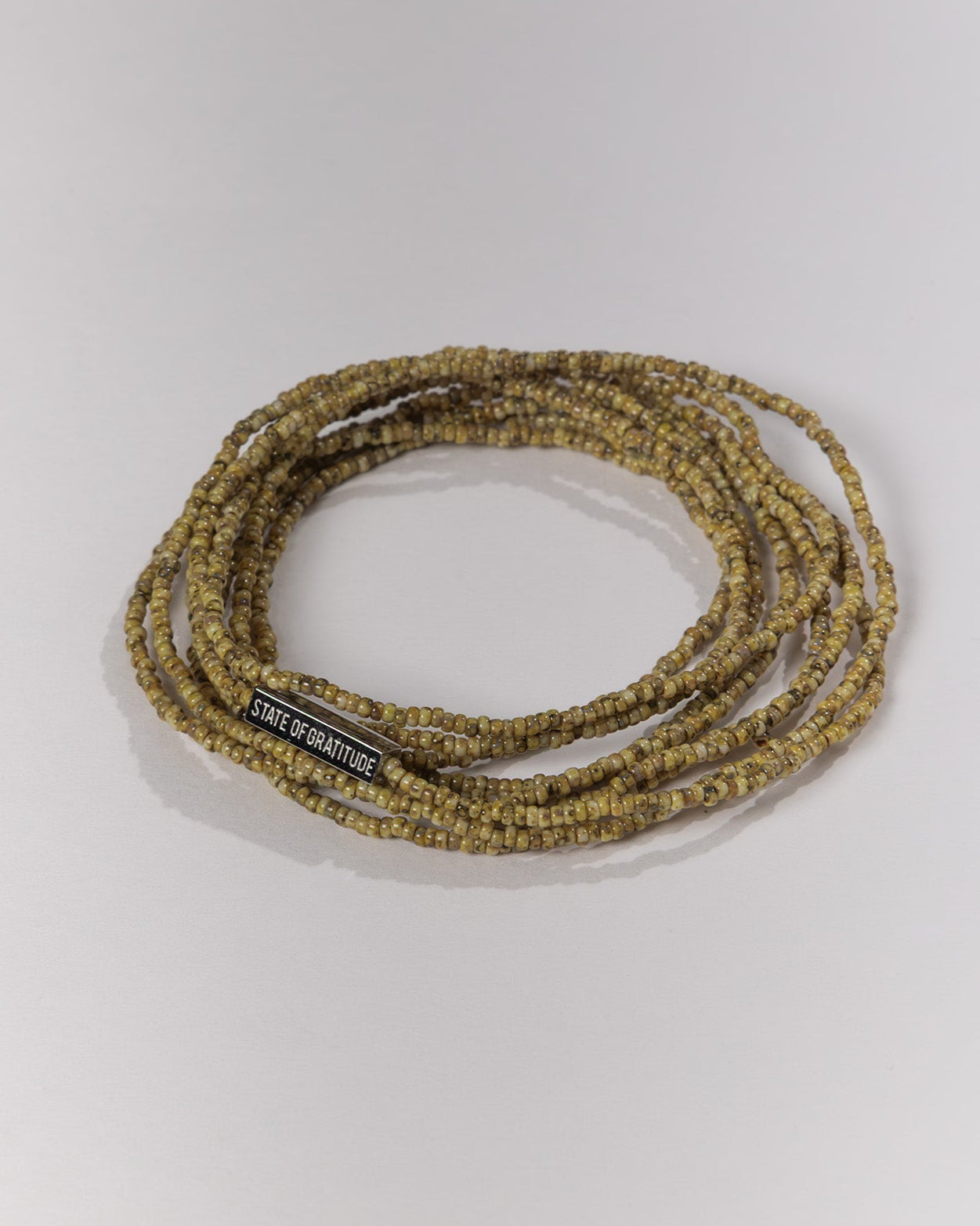 Beaded bracelet with a label on a white background
