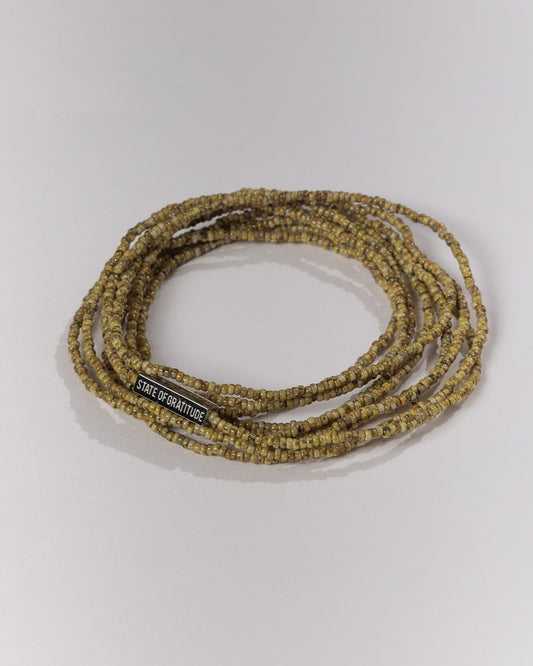 Beaded bracelet with a label on a white background